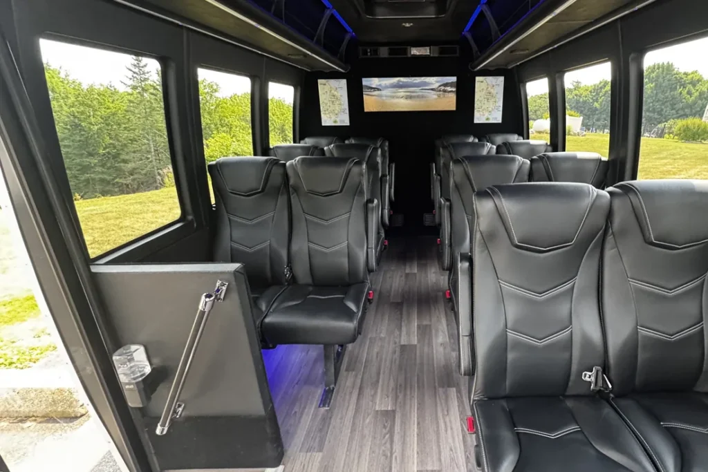 View down the aisle of the 14-passenger Acadia private tour mini-coach toward the front