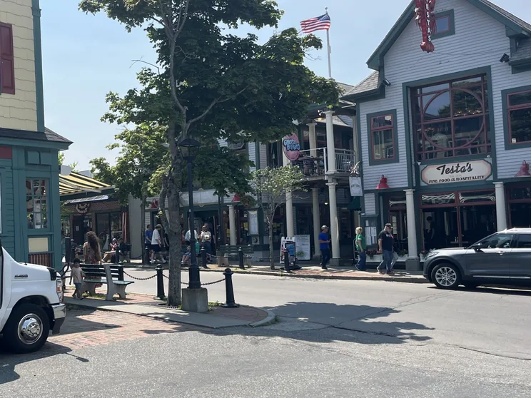 Guests boarding the Acadia National Park Tours shuttle outside Testa's on Main Street, downtown Bar Harbor