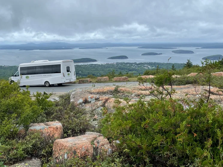 The Premium coach on the Cadillac Mountain summit road above Bar Harbor and the Porcupine Islands