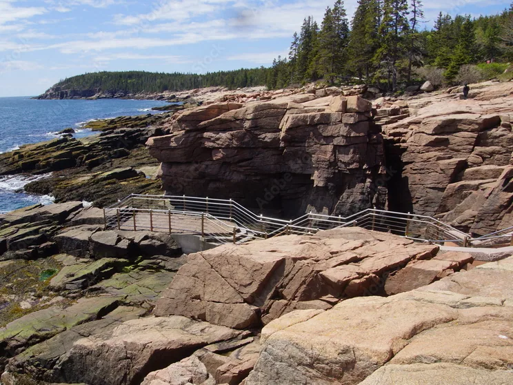 The railed viewing platform on the pink granite ledges at Thunder Hole above the Atlantic