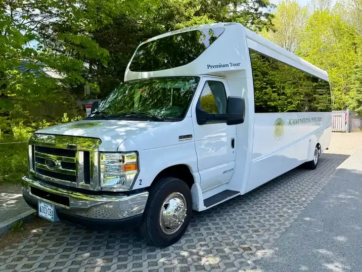 The Acadia National Park Tours Premium coach on the drive at the Jordan Pond House
